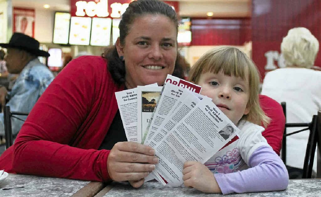 Sandra Ellis and four-year-old daughter Jessica assess their councillor and mayoral candidate options. Sandra Ellis and four-year-old daughter Jessica assess their councillor and mayoral candidate options.